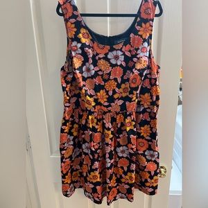 Black and multicolor flower dress with pockets and zip back (mid to low thigh)